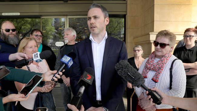 David Lawrence’s nephew, Blake Lawrence speaks to the media after the sentencing while surrounded by family and friends Picture: Dean Martin