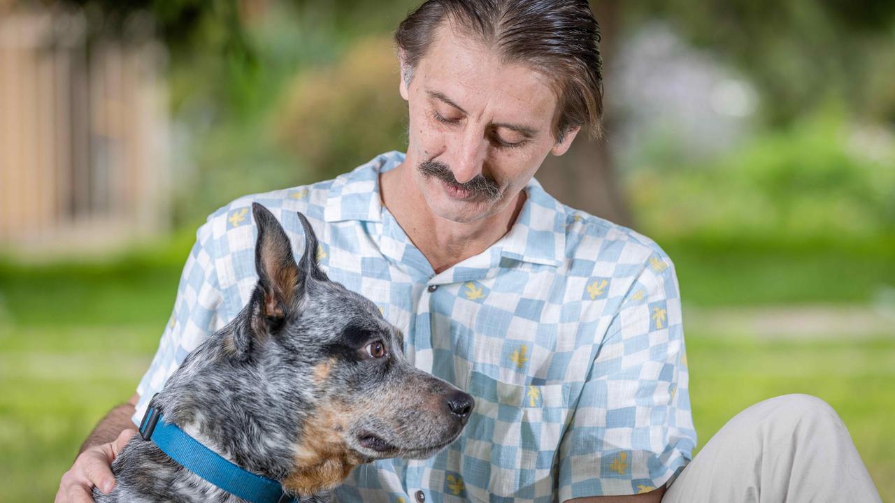 Kristian Kosh and his dog Buddy outside his Mitchell Park home. Picture: Ben Clark