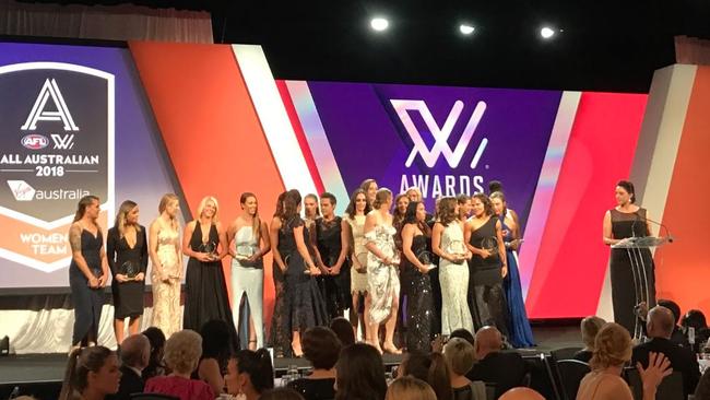 The 2018 AFLW All-Austtralian team on stage.