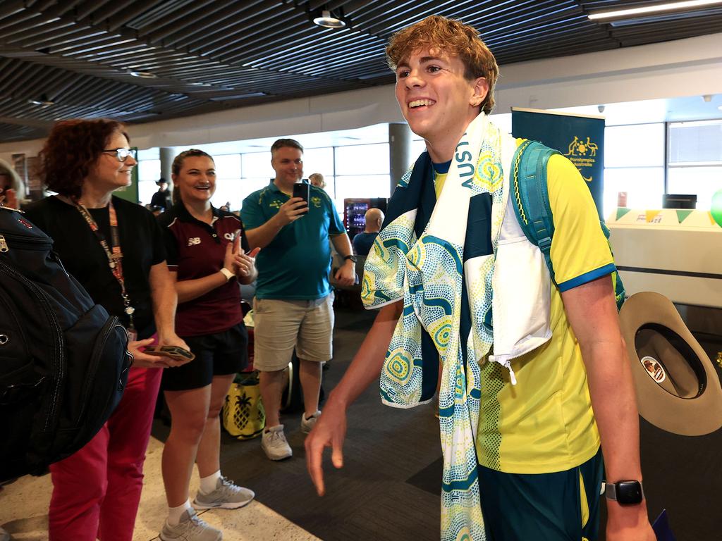 Paralympian Lewis Bishop arriving home to Brisbane. Picture: Adam Head