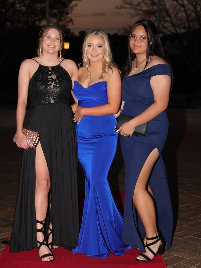 Syracuse Andrew, 17, Phoebe Anderson, 17, and Jacinta Wright, 17, at the Ormeau Woods School formal at Links Resort, Hope Island. Picture: Glenn Hampson