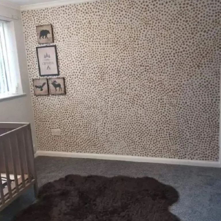 A UK mum transformed her son’s nursery using a cheap household item and some paint to create this ‘wallpaper’ feature. Picture: Supplied/Facebook