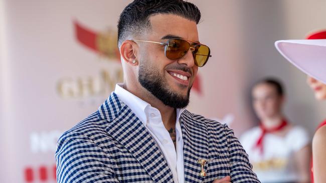 Lambo Guy Adrian Portelli, partner Karlie Butler. Lexus Melbourne Cup Day Flemington Racecourse on November 05, 2024 in Melbourne, Australia. Picture: Jason Edwards