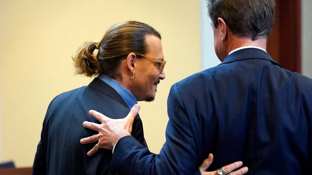 Johnny Depp embraces his attorney Benjamin Chew after closing arguments at the Fairfax County Circuit Courthouse in Fairfax, Virginia, on May 27, 2022. Picture: Steve Helber / POOL / AFP