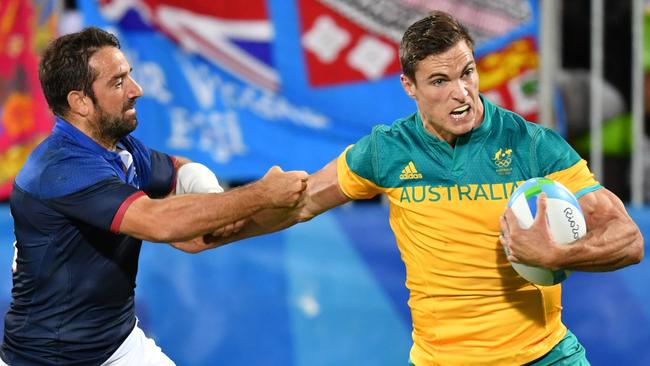 Australia's Ed Jenkins scores a try in the men’s Rugby Sevens match between France and Australia at the Rio Olympics.