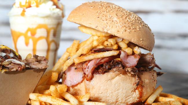 The "Pig Out" burger, filthy fries and apple pie milkshake at Getta Burger in Carindale. Picture: Tara Croser