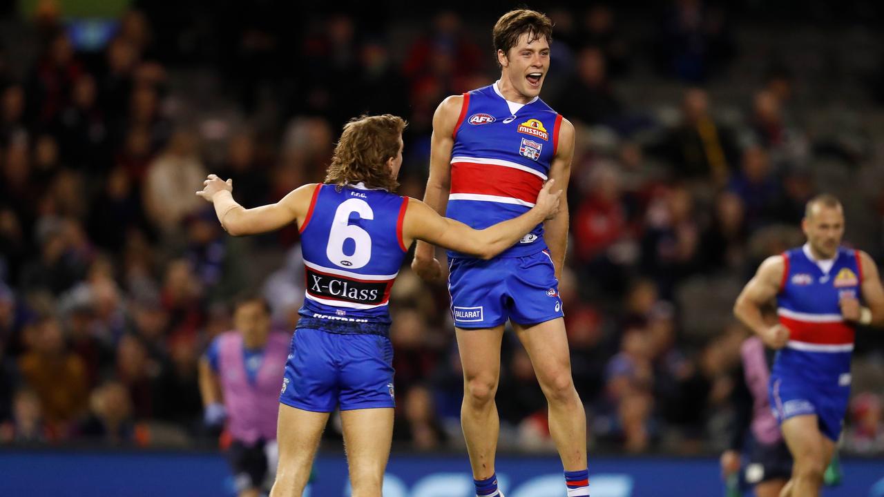 Josh Dunkley celebrates a goal against Melbourne in Round 17.