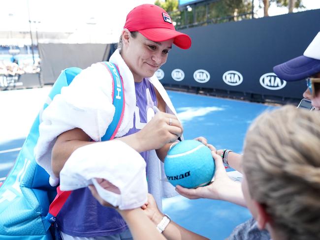 Ashleigh Barty of Australia signs autographs after taking part in a practice session on day 10 of the Australian Open tennis tournament in Melbourne, Wednesday, January 29, 2020. (AAP Image/Dave Hunt) NO ARCHIVING, EDITORIAL USE ONLY