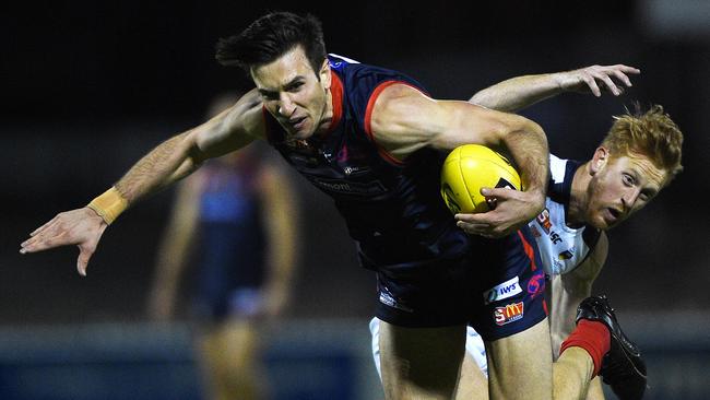 Norwood’s Matthew Panos looks to escape a SOuth tackle during the Redlegs’ loss on Friday night.