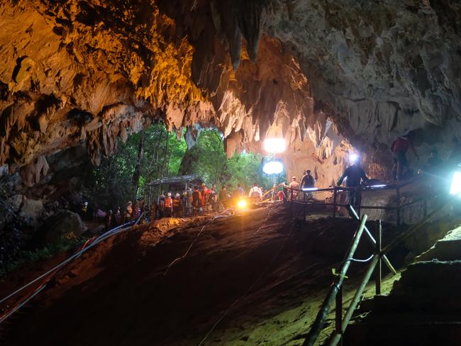 Rescuers install a water pump inside Tham Luang Nang Non cave.