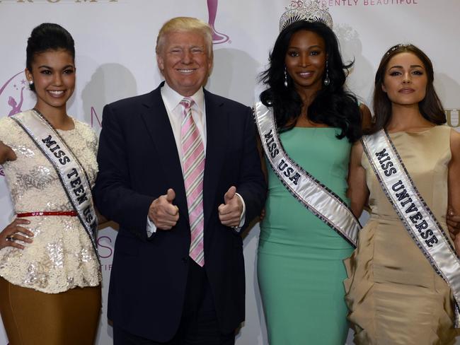 Donald Trump with Miss USA Nana Meriwether (C), Miss Universe Olivia Culpo (L) and Miss Teen USA Logan West. Picture: AFP