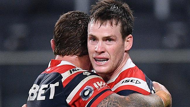 Luke Keary of the Roosters (right0 celebrates after scoring a try during the Round 7 NRL match between the Sydney Roosters and the St George Illawarra Dragons at Bankwest Stadium in Sydney, Friday, June 26, 2020. (AAP Image/Dan Himbrechts) NO ARCHIVING, EDITORIAL USE ONLY