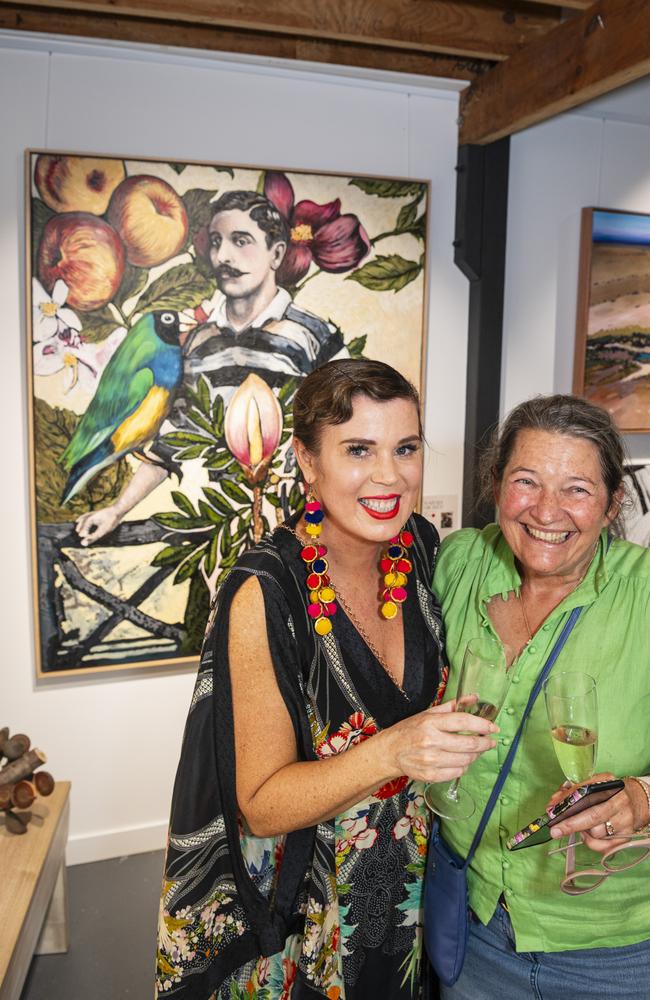 The Next Big Thing finalist Sarah Hickey (left) with Jenny Durack who purchased her work Gentle Man (Guardian of Avian Children) (back, left) at The Toowoomba Gallery, Friday, March 1, 2024. Picture: Kevin Farmer