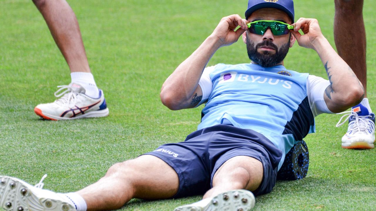 Virat Kohli does stretching exercises during a training session at Adelaide Oval.