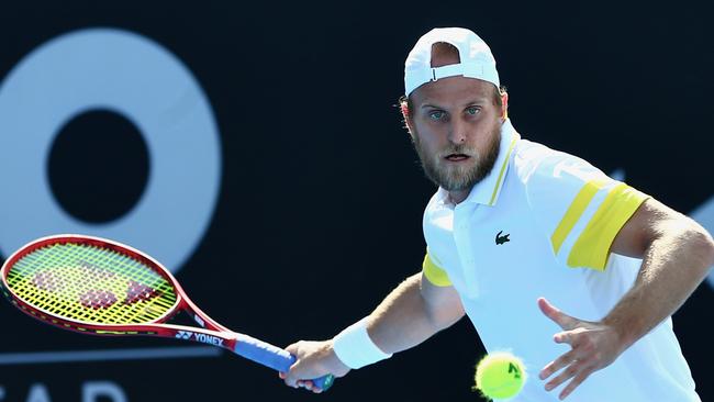 Denis Kudla hits a return to plays Elliot Benchetrit during Australian Open qualifying at the Khalifa International Tennis and Squash Complex in Doha Picture: Samer Alrejjal / Tennis Australia