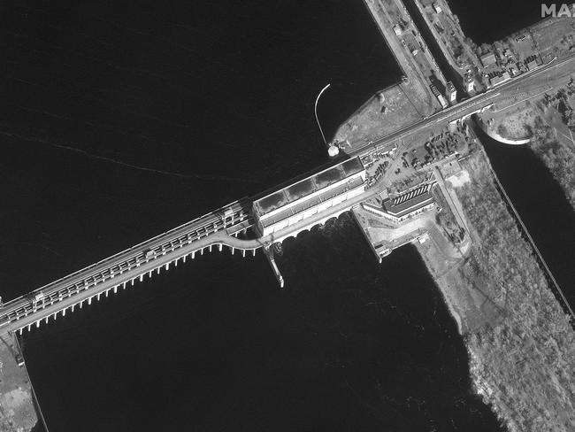 An overview of the Kakhovka hydroelectric plant on the Dnieper River in southern Ukraine taken on February 26, where Russian ground forces have assembled. AFP / Satellite image Â©2022 Maxar Technologies