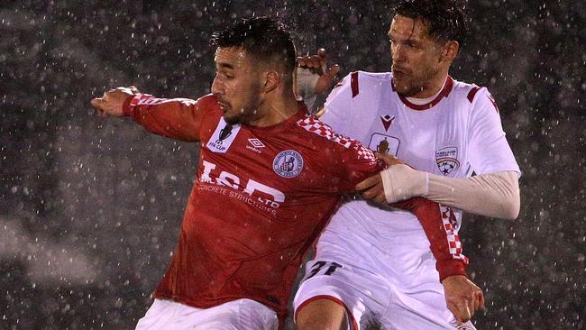 Gian Albano of the Knights (left) contests with Mirko Boland of United during the FFA Cup Round of 32 match between the Melbourne Knights and Adelaide United at Knights Stadium in Melbourne, Wednesday, August 7, 2019. (AAP Image/Hamish Blair) NO ARCHIVING, EDITORIAL USE ONLY