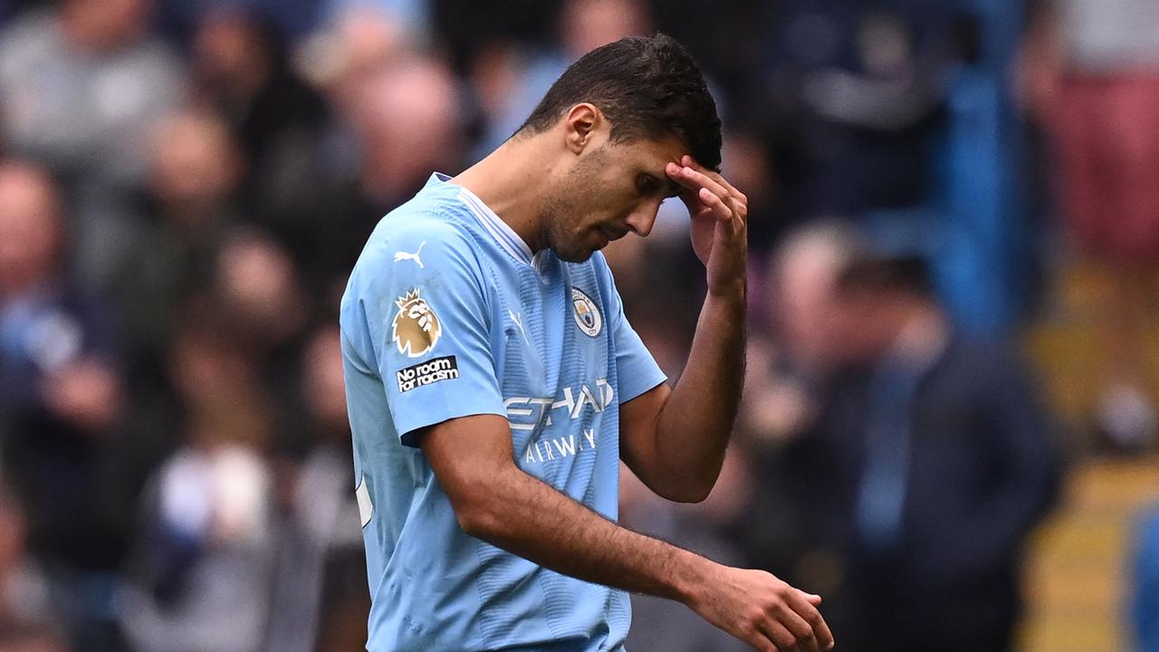 Manchester City's Spanish midfielder #16 Rodri reacts as he leaves the pitch having been sent off during the English Premier League football match between Manchester City and Nottingham Forest at the Etihad Stadium in Manchester, north west England, on September 23, 2023. (Photo by Oli SCARFF / AFP) / RESTRICTED TO EDITORIAL USE. No use with unauthorized audio, video, data, fixture lists, club/league logos or 'live' services. Online in-match use limited to 120 images. An additional 40 images may be used in extra time. No video emulation. Social media in-match use limited to 120 images. An additional 40 images may be used in extra time. No use in betting publications, games or single club/league/player publications. /