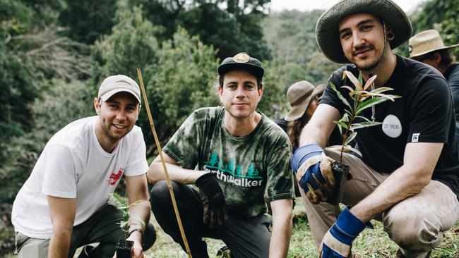 Australian hard rock band In Hearts Wake plant trees to offset carbon emissions of new record. Picture: Supplied.