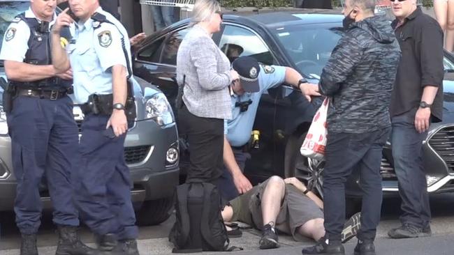 Emergency crews attend to the injured officer in the Stanhope Village Shopping Centre carpark in Stanhope Gardens. Picture: TNV