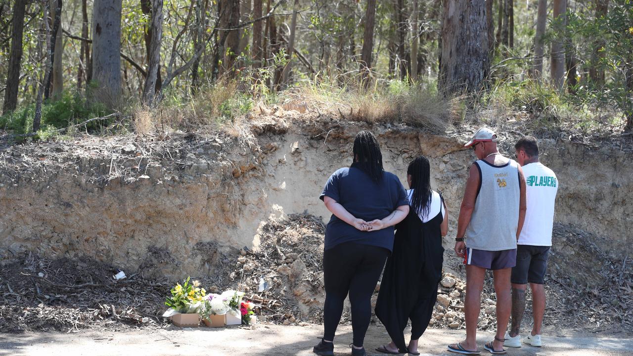 Relatives leave tributes at the scene where a 30-year-old man died after a single-vehicle crash at Worongary, in the Gold Coast hinterland. Picture Glenn Hampson