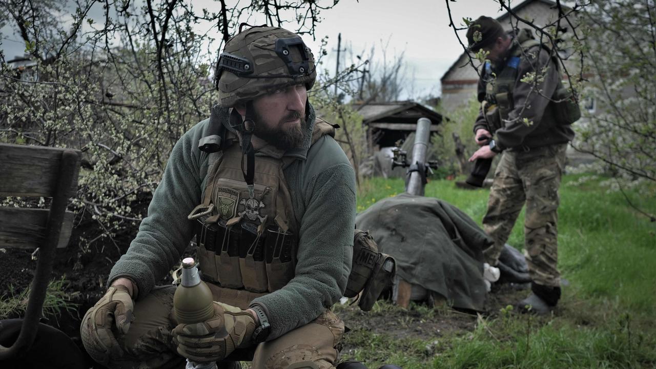 Servicemen of Ukrainian Volunteer Army fire from 82mm mortar toward Russian position near Ugledar, Donetsk region on April 21, 2023. Picture: AFP