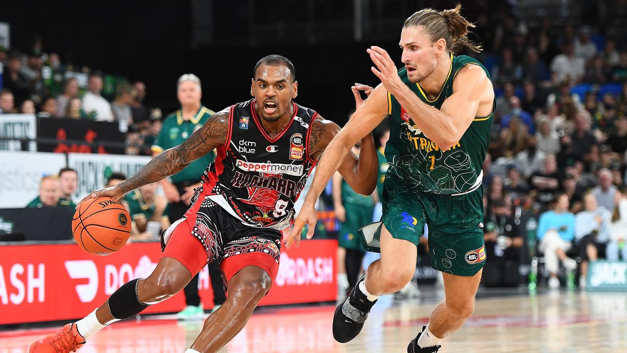 HOBART, AUSTRALIA - MARCH 13: Xavier Rathan-Mayes of the Hawks drives past Matt Kenyon of the Jackjumpers during the round 15 NBL match between Tasmania Jackjumpers and Illawarra Hawks at MyState Bank Arena on March 13, 2022, in Hobart, Australia. (Photo by Steve Bell/Getty Images)