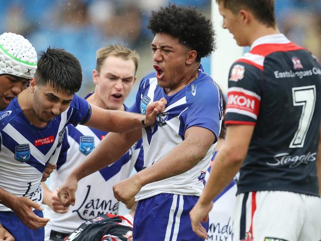 First Round match of the SG Ball competition between Roosters and Bulldogs at Belmore Oval today with Bulldogs winning 26-16. Pictured is Bulldog's Paul Alamoti (centre of frame) celebrates after he scored his second try of the match. Picture: David Swift.