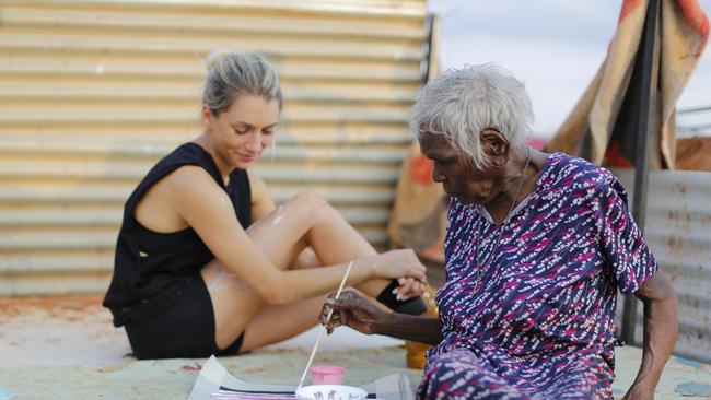 Founder of Pwerle Gallery Jade Torres with her great grandmother Molly Pwerle in 2021 on their country 'Atnwengerrp'. Picture: Supplied