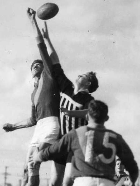 Dean Trowse, right, rucks against West Torrens’ Don Prior in 1953.