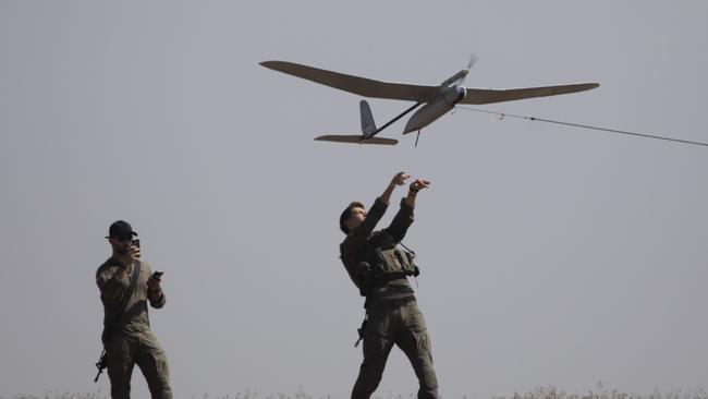 Israeli soldiers lift a drone near the border with the Gaza Strip on April 15. Picture: Amir Levy/Getty Images