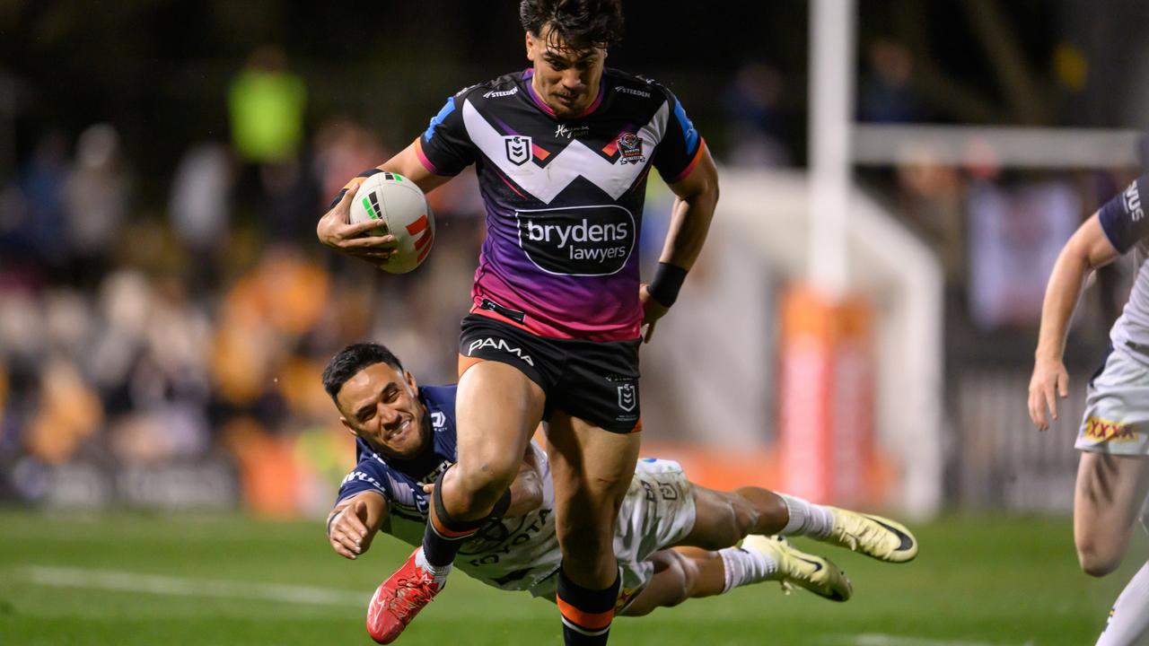 Valentine Holmes of the Cowboys attempts to tackle Solomona Faataape. (Photo by James Gourley/Getty Images)