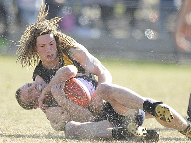 Seaford’s Chris Irving tackles EdiAsp's Mark Fitcher in the 2008 grand final.