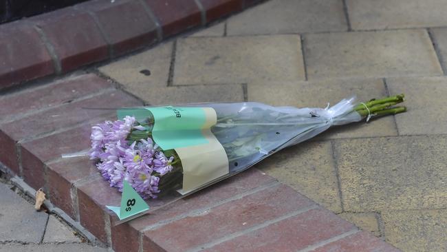 Flowers were left outside Port Adelaide Police Station after the death of a female officer in January. Picture: Roy VanDerVegt