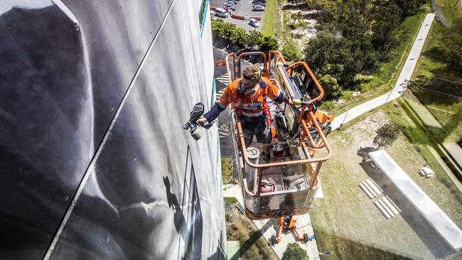 Guido van Helten will finish the second wall this week. Picture: NIGEL HALLETT