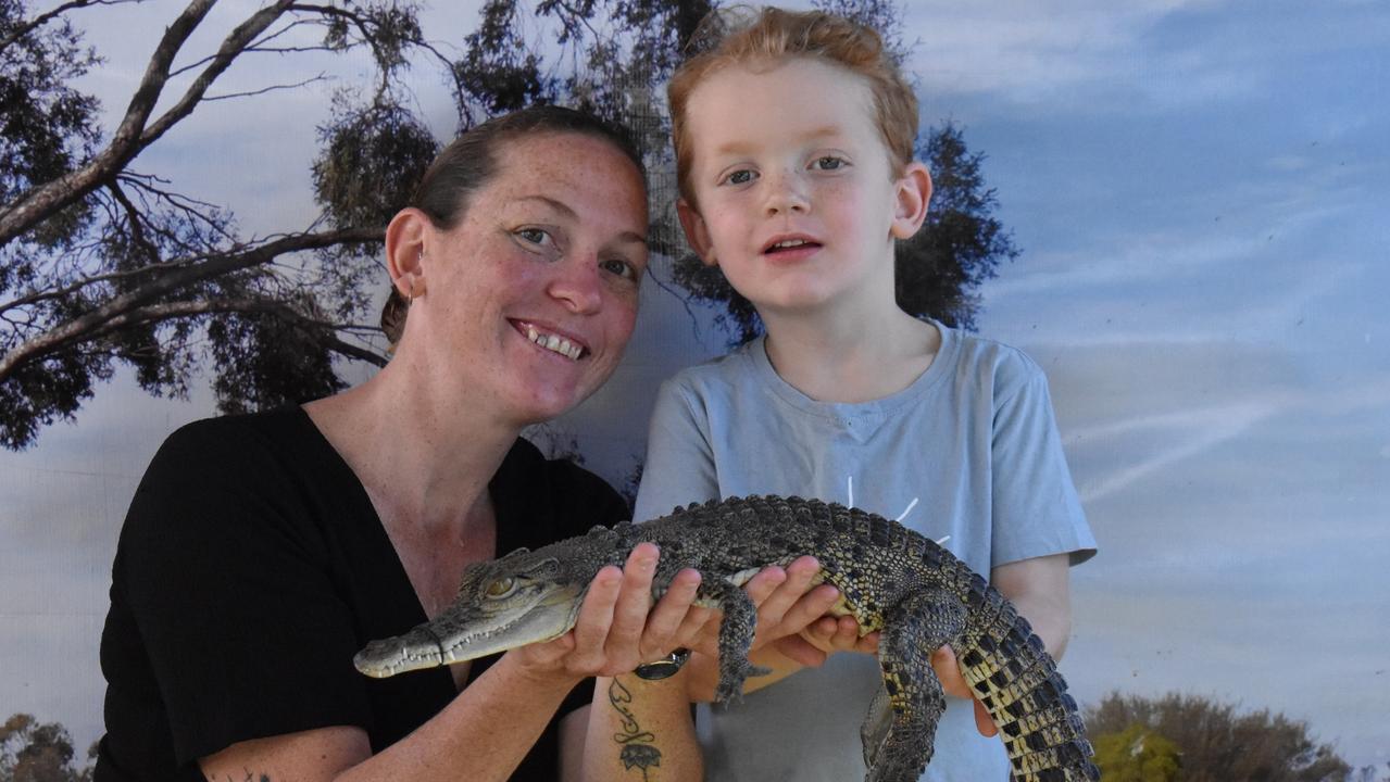 Sam Yuskan and Liam Stoneham of Conway got up close and personal with a baby crocodile at Show Whitsunday. Picture: Kirra Grimes