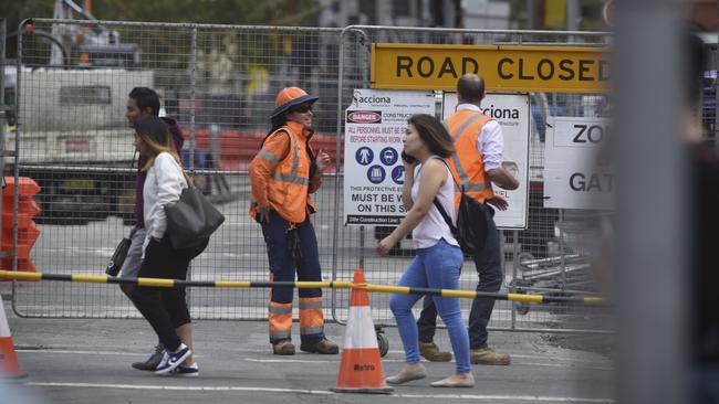 Light rail staff and their activities have become a long-entrenched feature of city life for many. Picture: Dominic O’Brien