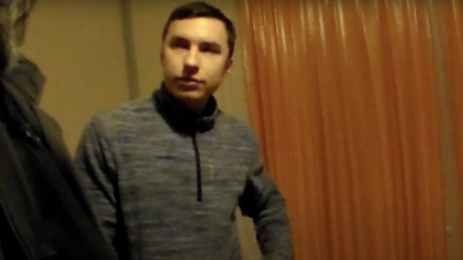 Artem Vasilyev in the video shot by police in his home.