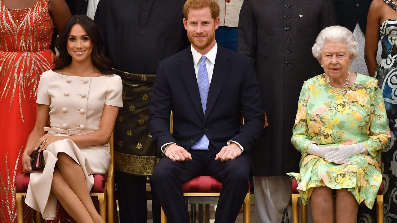 Meghan Markle, Prince Harry, Duke of Sussex and the Queen during the Queen’s Young Leaders Awards Ceremony. Picture: John Stillwell/AFP.