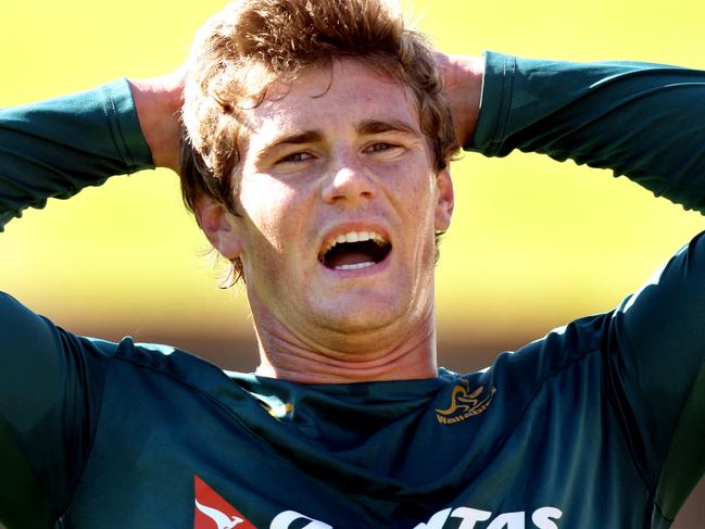 Rugby- Wallaby training at Leichhardt Oval .Berrick Barnes during a fitness drill , while the rest of the team train . Pic;Gregg Porteous