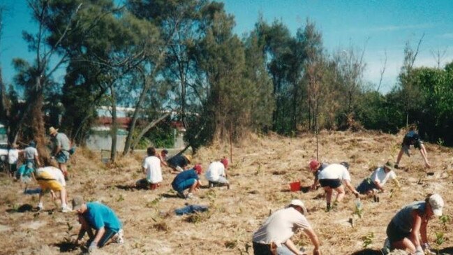 Federation Walk volunteers work on The Spit about 20 years ago to help provide tree cover.