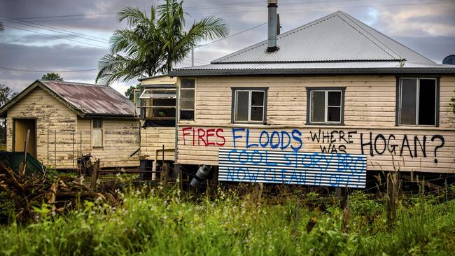 This photo taken on May 15, 2022, shows houses with political graffiti after the floods devastated Lismore. Picture: Patrick Hamilton / AFP