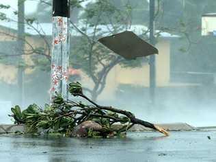 28/3/17: a "keep left" flies past down the street after being ripped from its post as the wind and rain reach their peak as the eye of the cyclone gets closer, in the main street as Bowen begins to feel the increasing effects of driving rain and strong winds of tropical cyclone Debbie. Picture: Lyndon Mechielsen