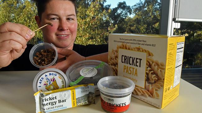 University of Adelaide Professor Kerry Wilkinson with a range of edible insects and insect-related products such as cricket pasta, protein bars and protein powder. Picture: Tom Huntley