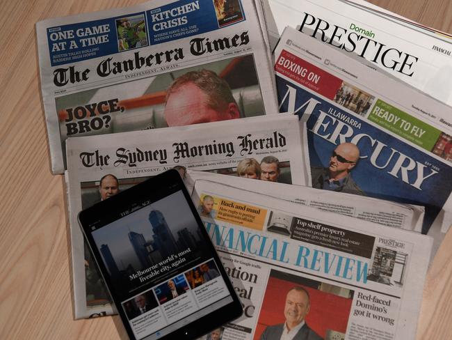 Newspaper titles including The Sydney Morning Herald, The Age, The Canberra Times, The Australian Financial Review and the Illawarra Mercury - published by Fairfax Media- are seen in Sydney, Wednesday, Aug. 16, 2017. Fairfax Media today announced a net profit in the year through to June 25th of $83.9 million, compared to a loss of $773 million in the prior period. Revenue, however, fell 5 per cent to $1.74 billion. (AAP Image/Dean Lewins) NO ARCHIVING