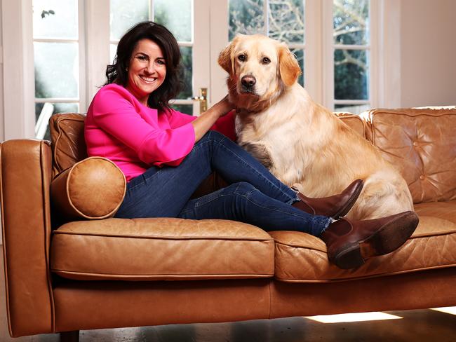 Jo Palmer with golden retriever Ruby at her Launceston home. Picture: Zak Simmonds