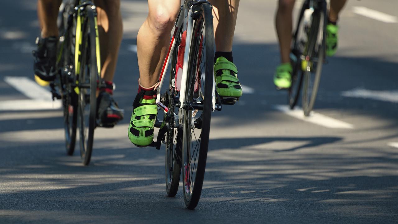 Cyclist athletes riding a race at high speed