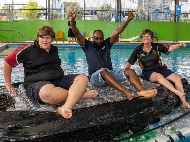 Peter, Ted Chirema and Carol Ayres at Henbury School gets ready for their new boat named Ironic design and construction for the Darwin Lions Beer Can Regatta.Picture: Pema Tamang Pakhrin