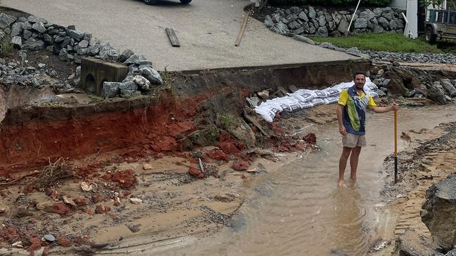 Erosion after flood waters receded on Marshall St in Machans Beach.