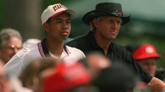 In younger days, US Amateur champion Tiger Woods and Greg Norman at the 1995 US Masters at Augusta. Picture: Steve Munday/ALLSPORT